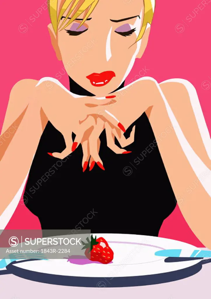 Woman with one strawberry on her plate