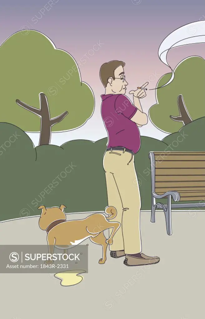 Man waiting for dog to urinate in the park