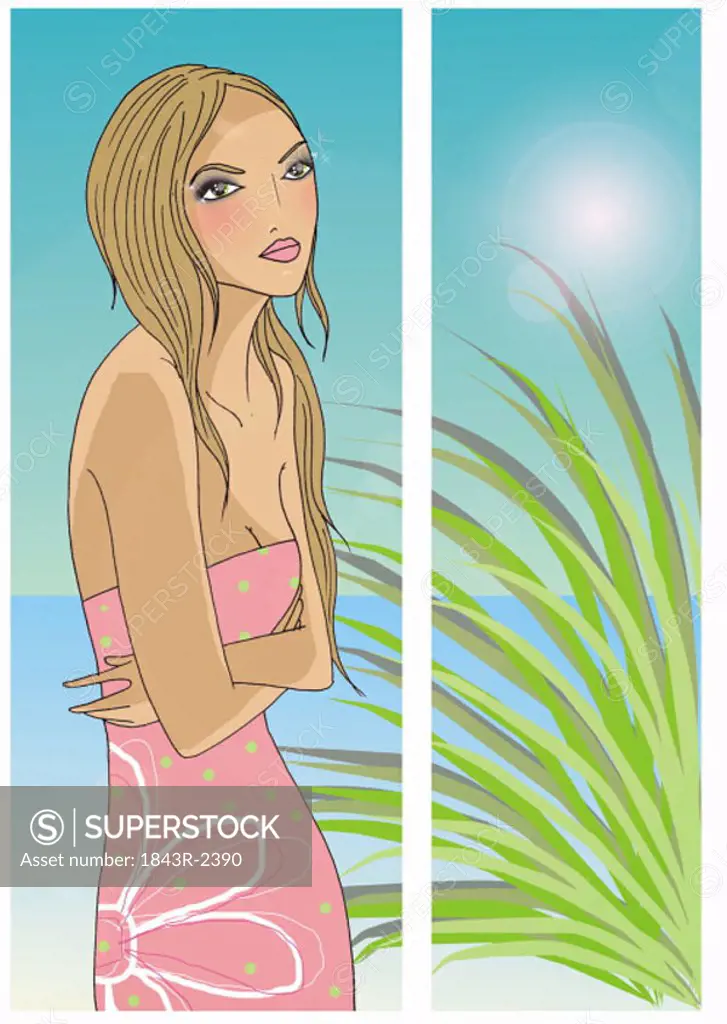 Young woman pensive with her arms folded in a tropical setting