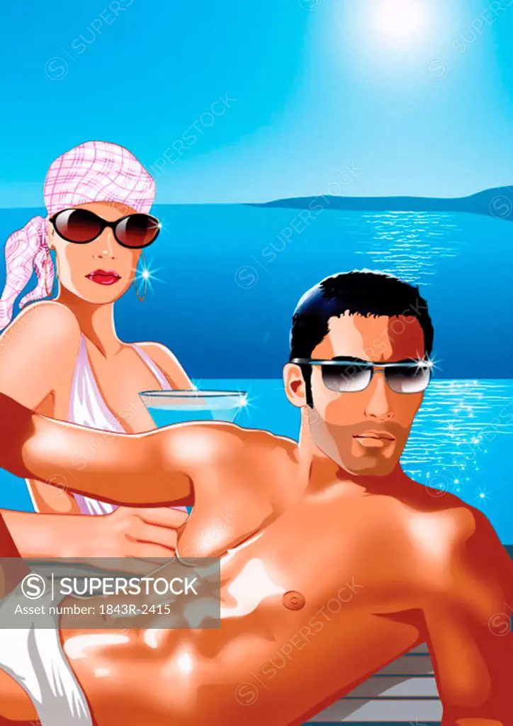 Young couple sitting by poolside on an island