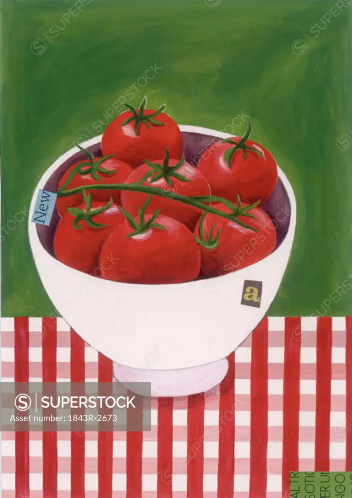 A bowl of tomatoes on the vine