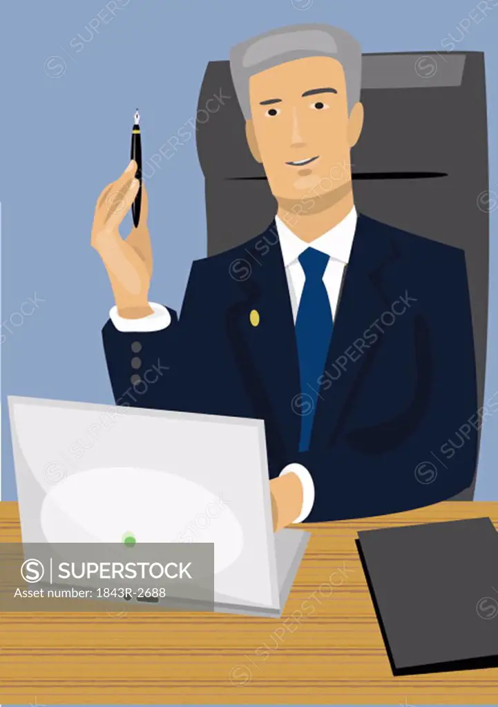 Businessman at desk with laptop