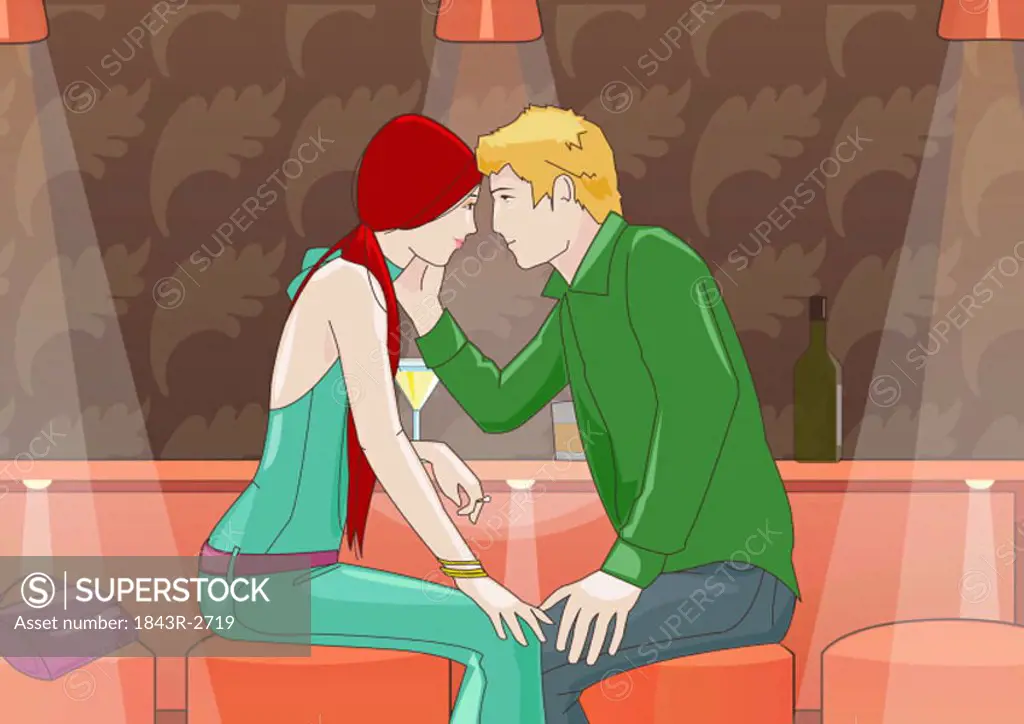 Young couple looking into each other´s eyes in a club