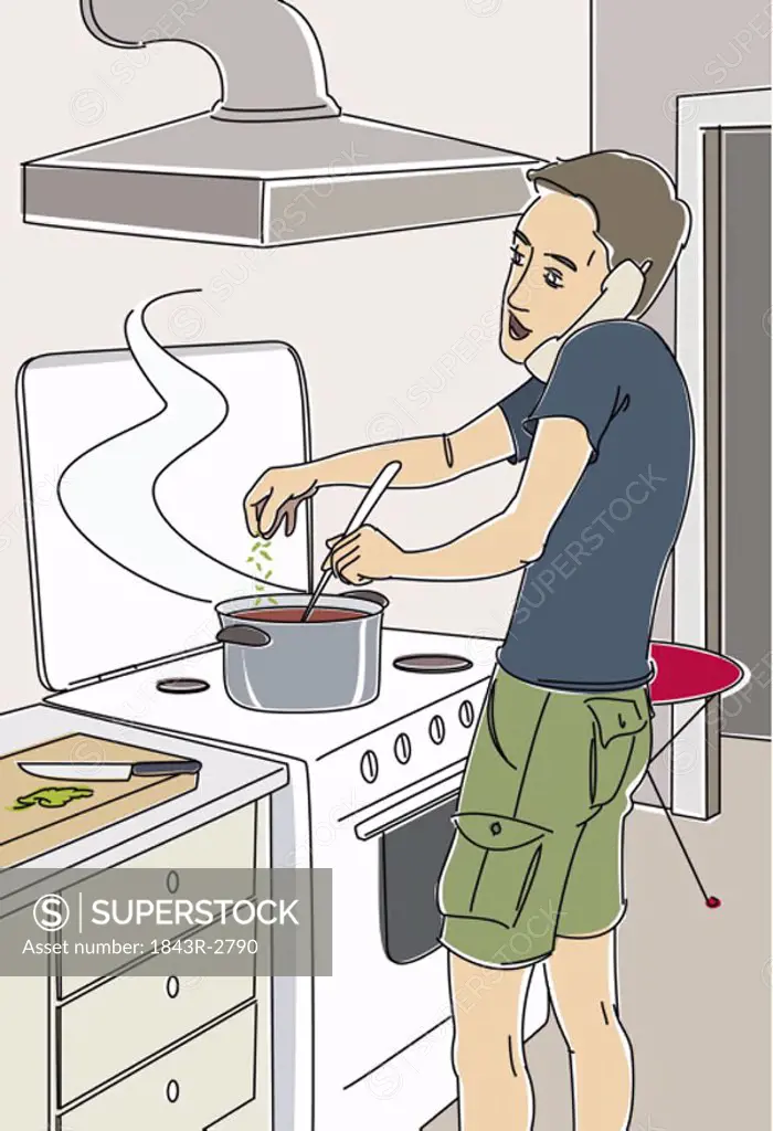 Man cooking dinner on the phone