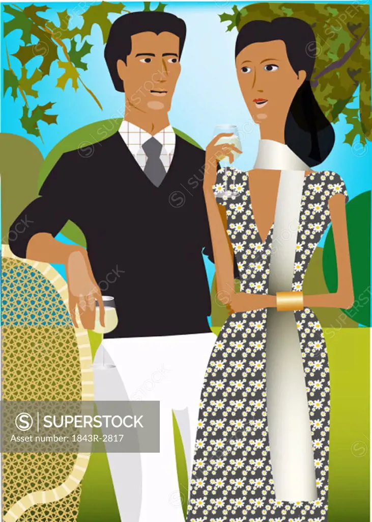Well-dressed couple enjoying a drink in the garden