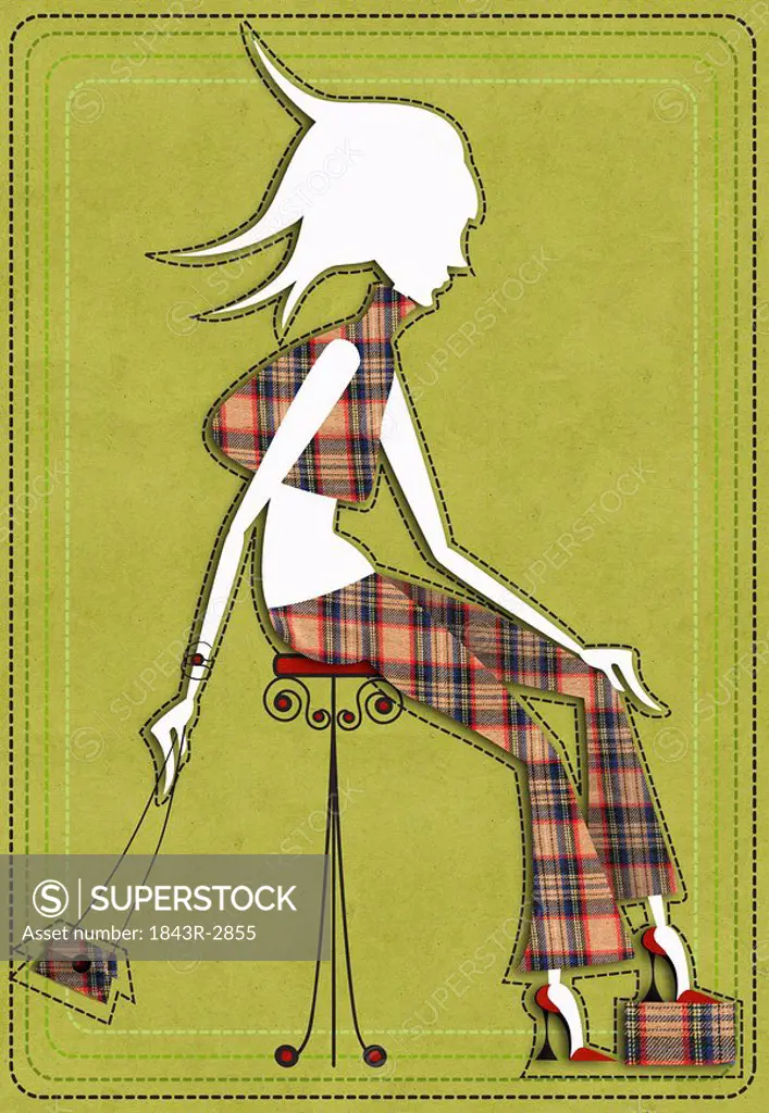 Woman on stool wearing checkered outfit
