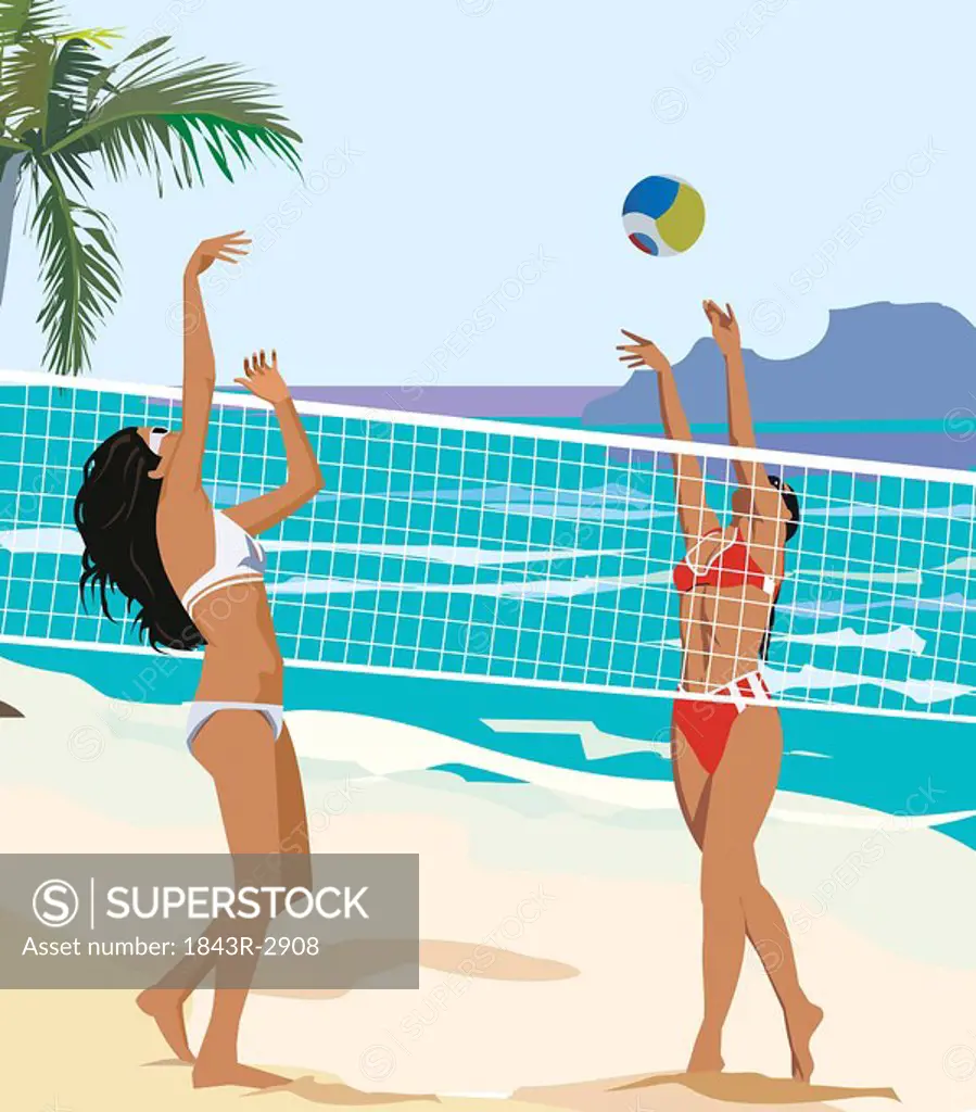 Two young ladies playing volley ball on the beach