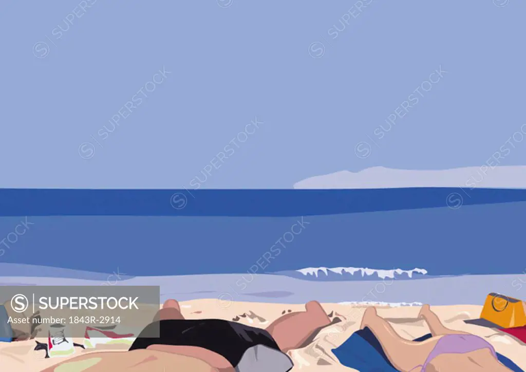 Lower bodies of people sunbathing on beach