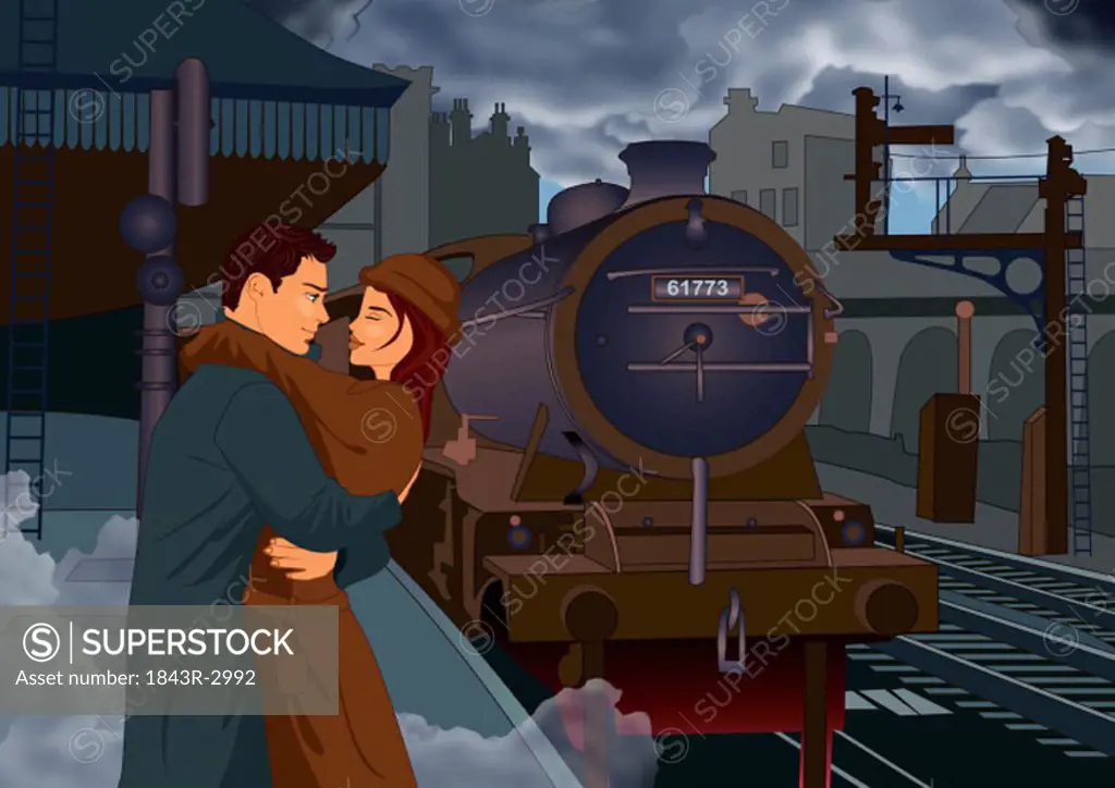 Young couple embracing at train depot just before the kiss