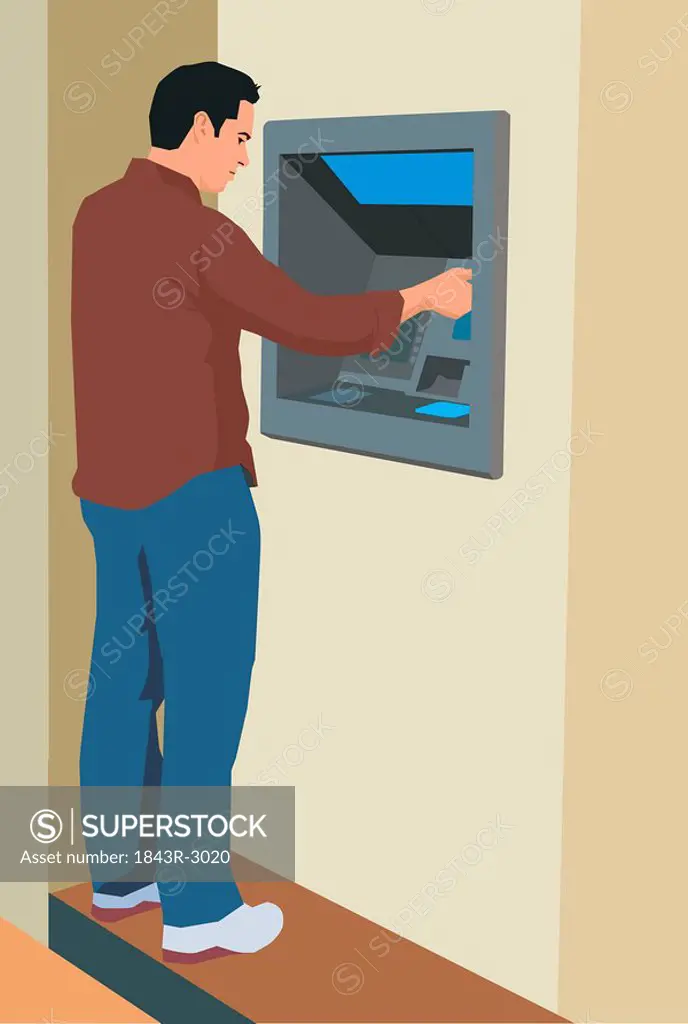 Young man using an ATM machine