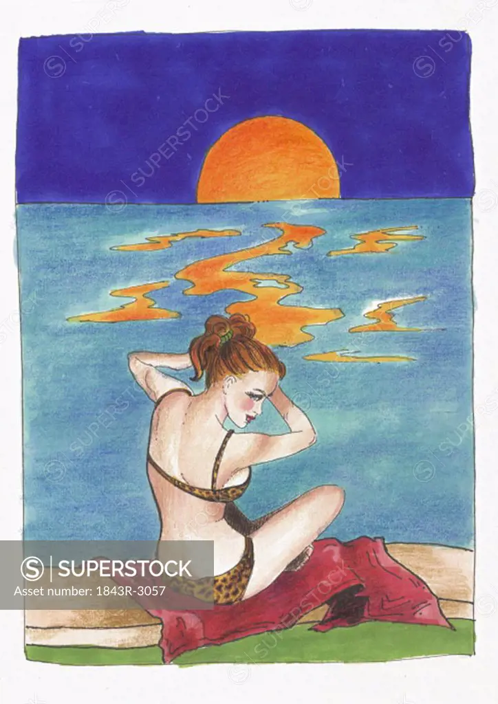 Woman with leopard bikini on beach at sunset