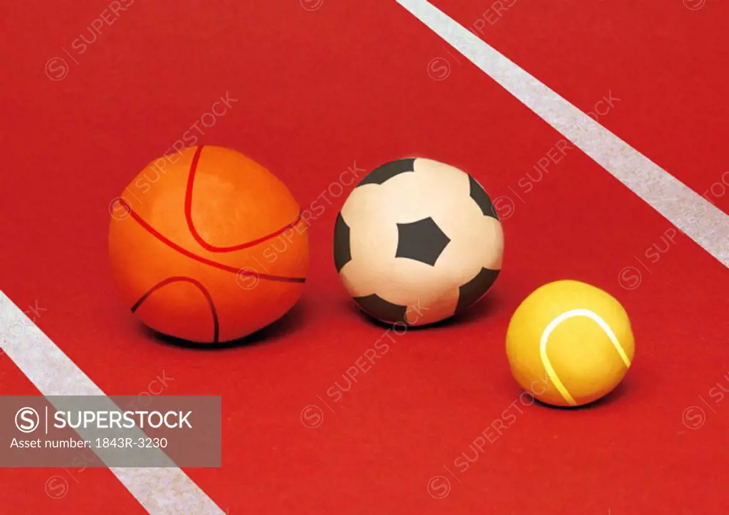 A basketball, a soccer ball, and a tennis ball