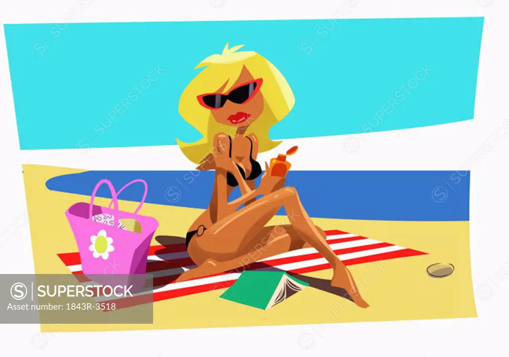 Blonde on beach towel applying suntan lotion