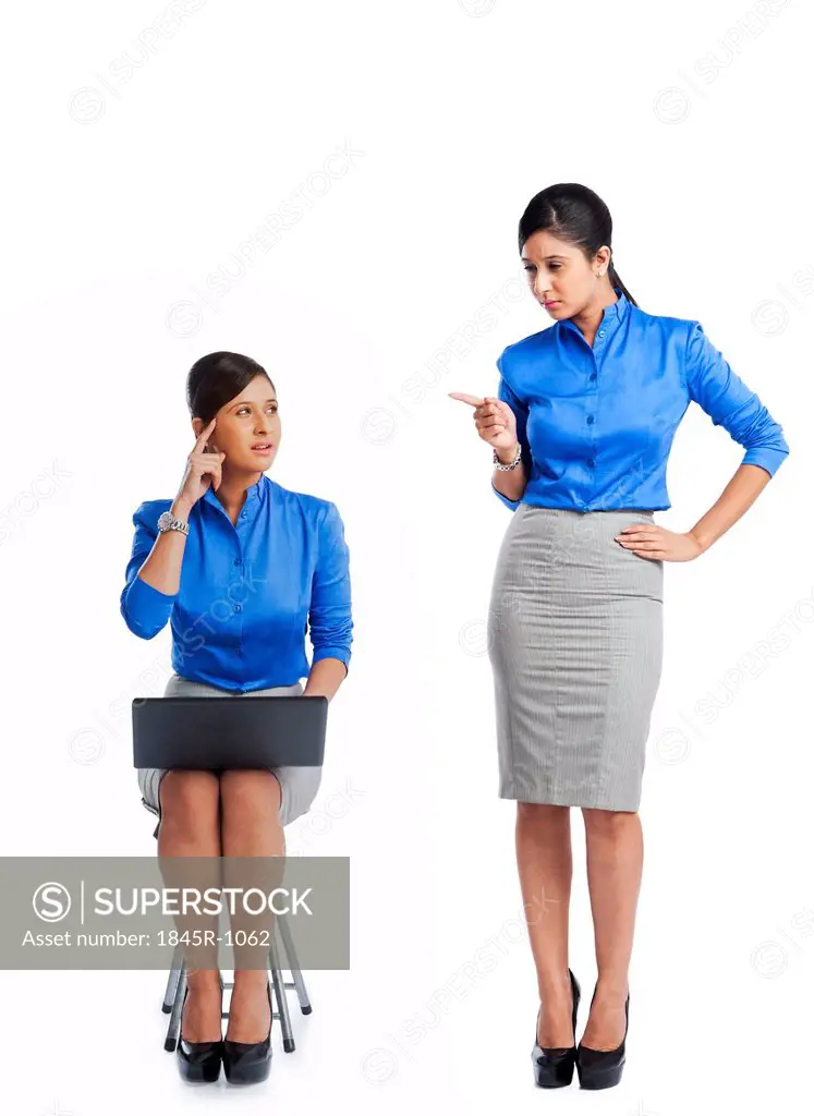 Businesswoman talking to her clone