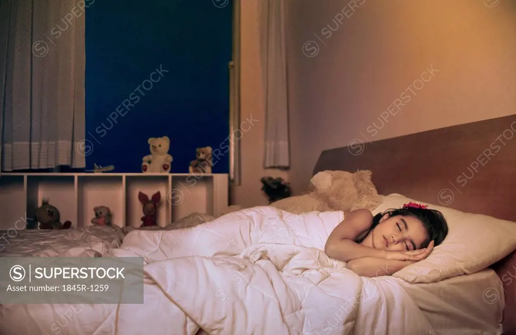 Girl sleeping on the bed