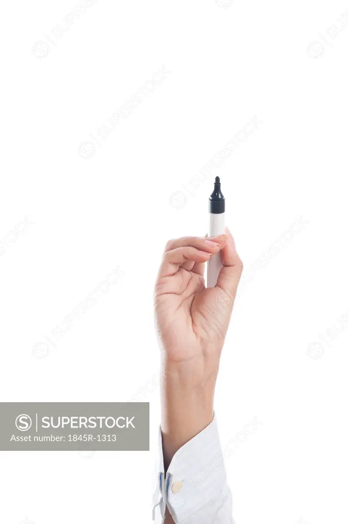 Human hand holding felt tip pen