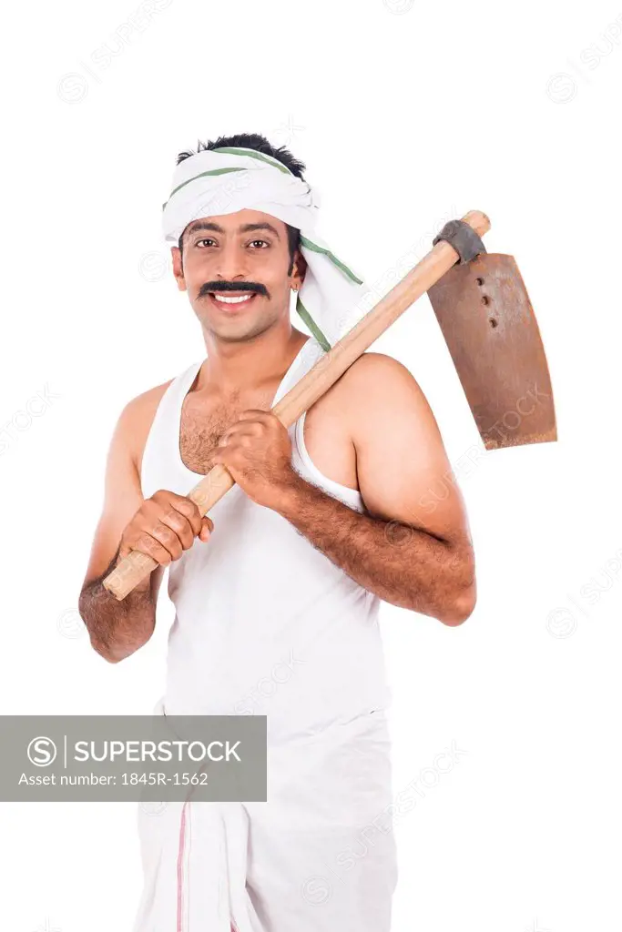 Portrait of a farmer carrying spade on his shoulders