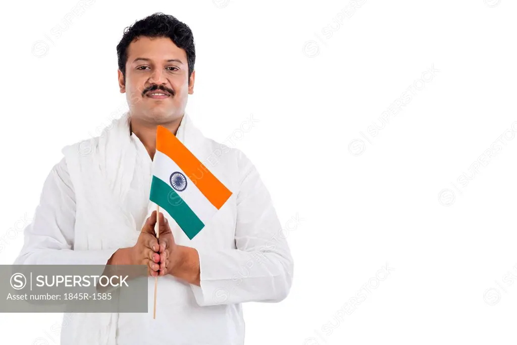 Portrait of a man holding national flag of India