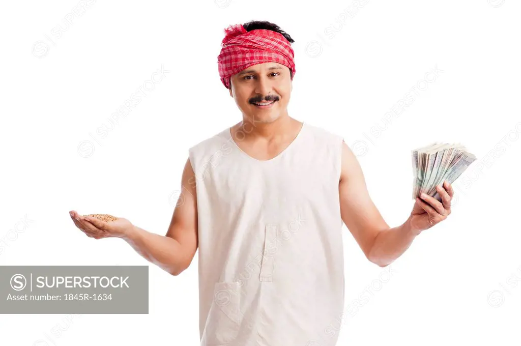 Portrait of a farmer holding money in one hand and wheat in another hand