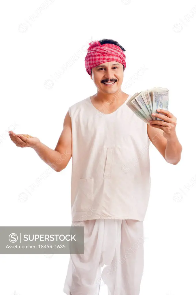 Portrait of a farmer holding money in one hand and wheat in another hand