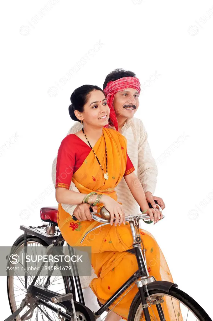 Couple riding a bicycle