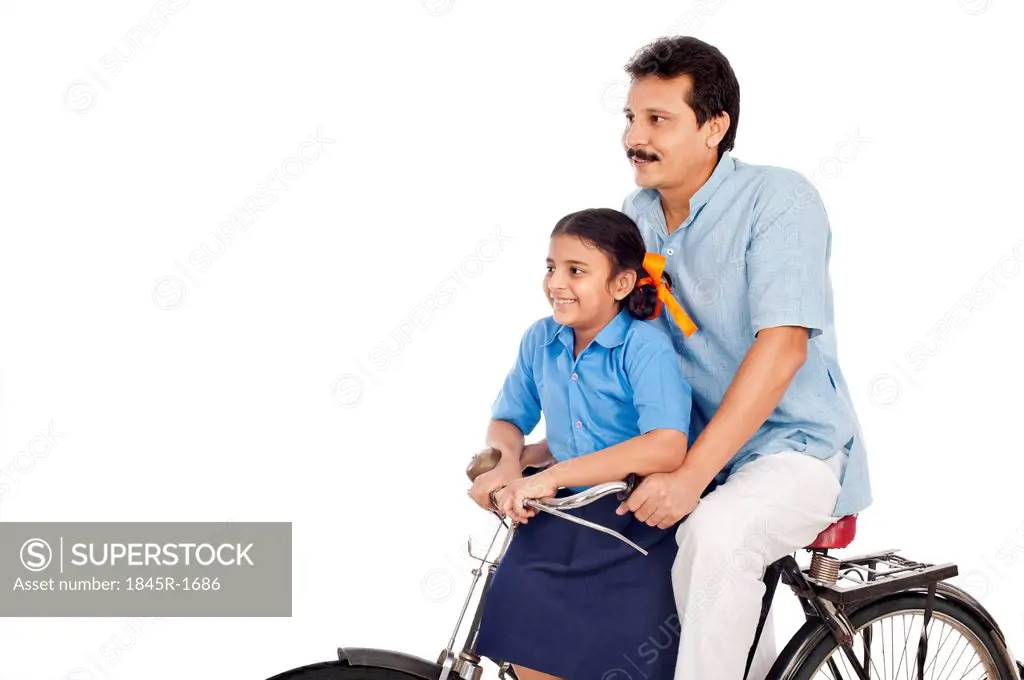 Man with his daughter on a bicycle