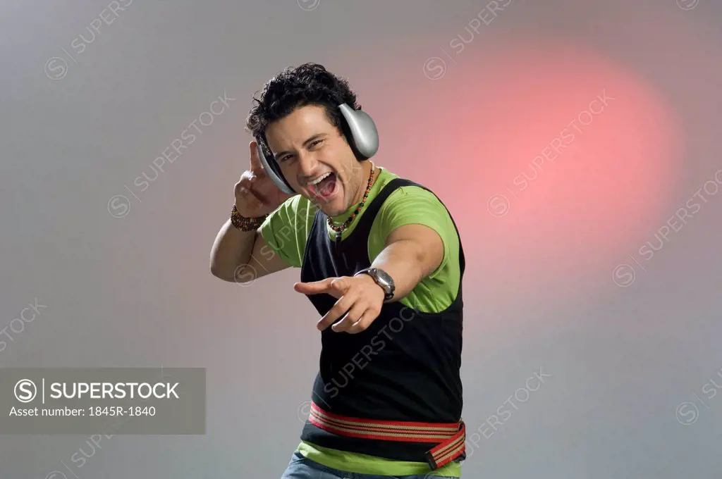 Man listening to music and looking excited