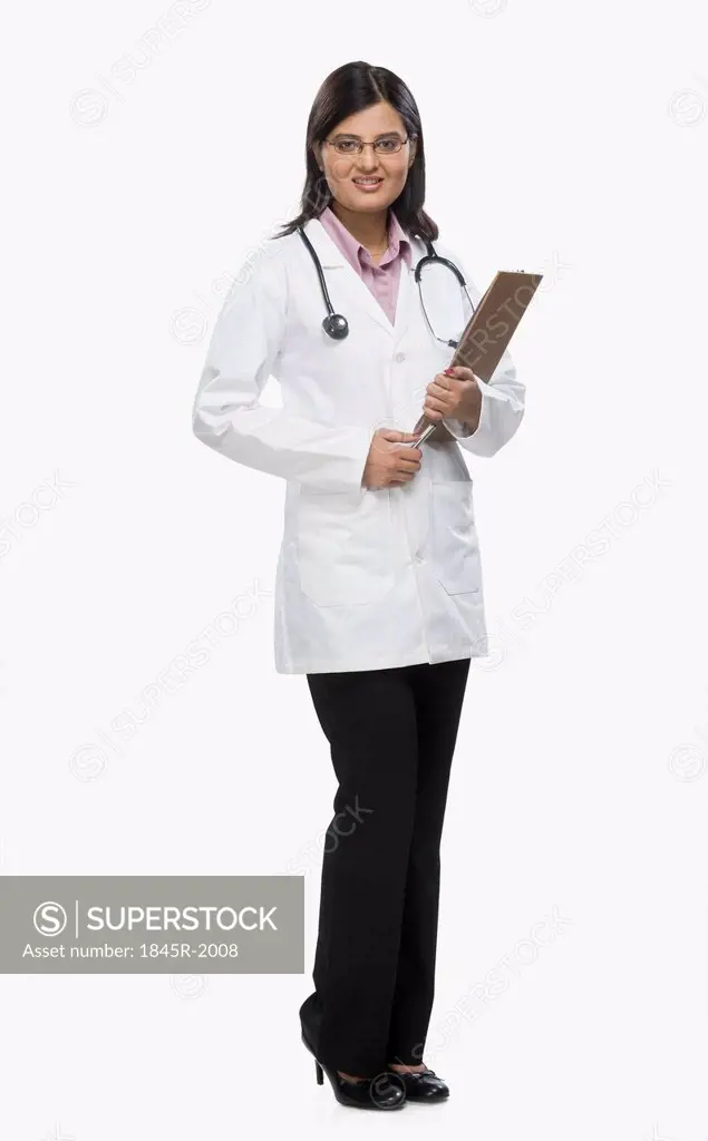 Female doctor holding a clipboard and smiling