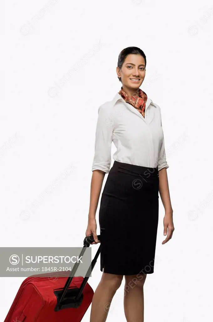 Air hostess carrying her luggage