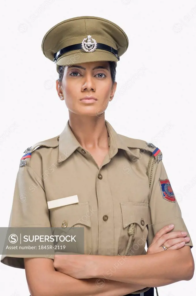 Portrait of a female police officer with her arms crossed