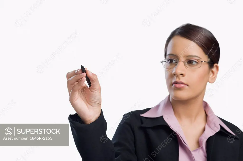 Businesswoman writing with a felt tip pen