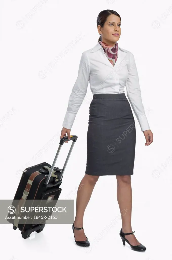 Air hostess carrying her luggage