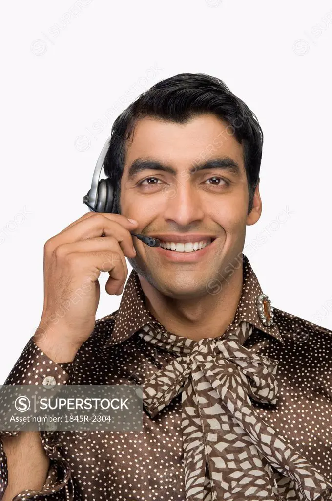 Portrait of a male customer care representative wearing a headset