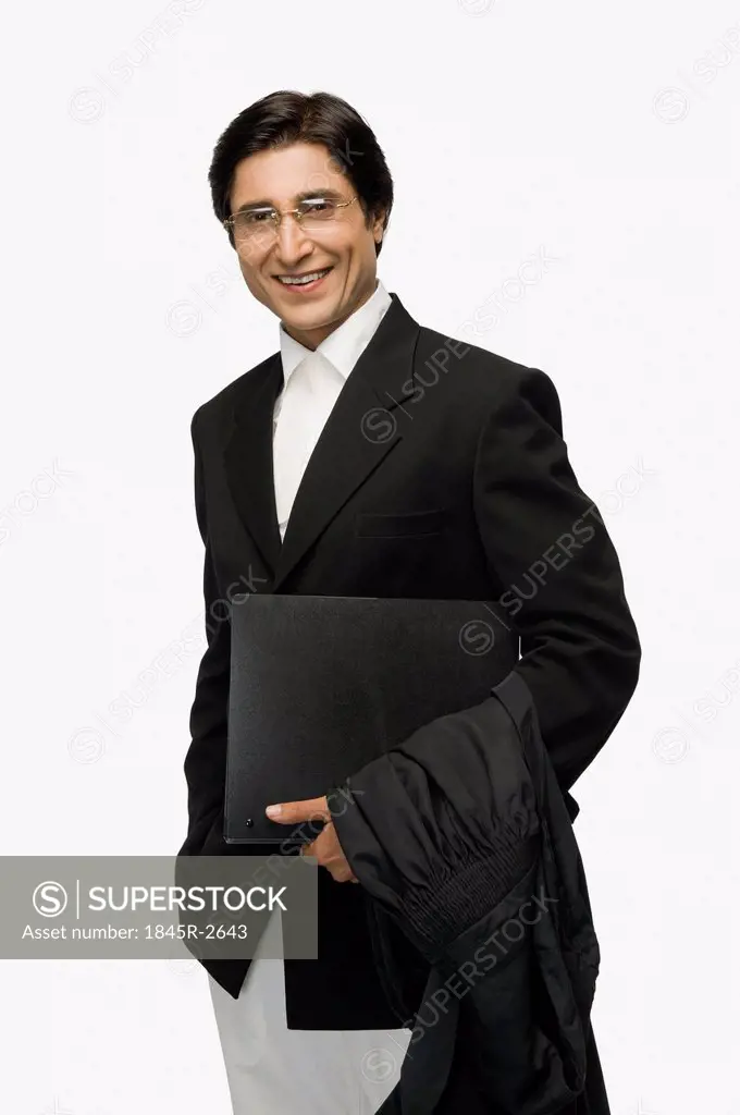 Portrait of a lawyer holding a file and smiling