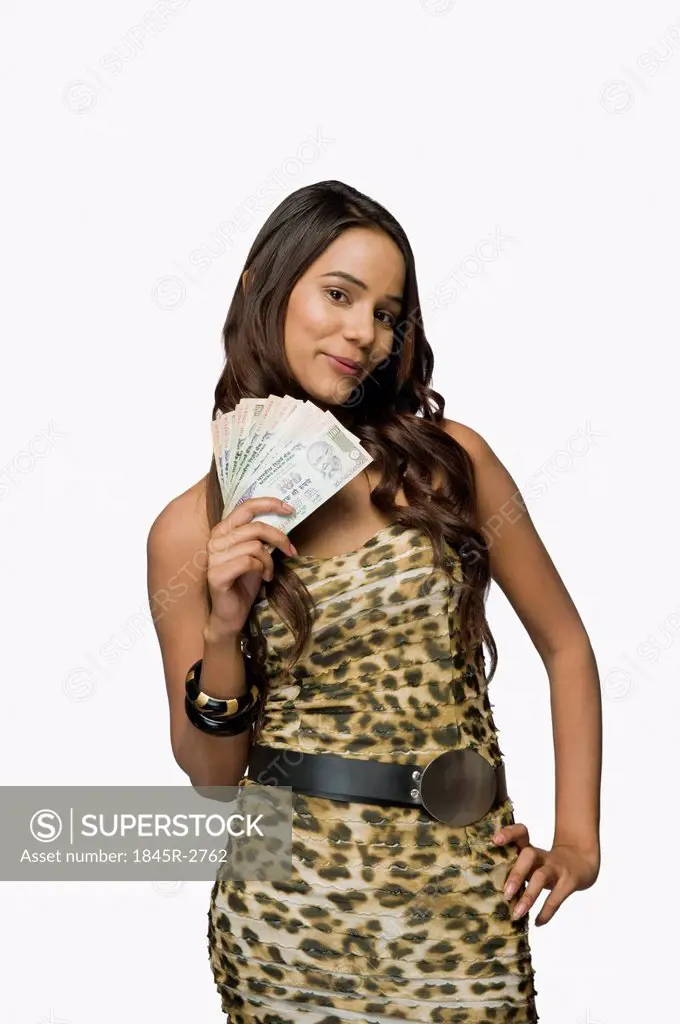 Woman holding currency notes