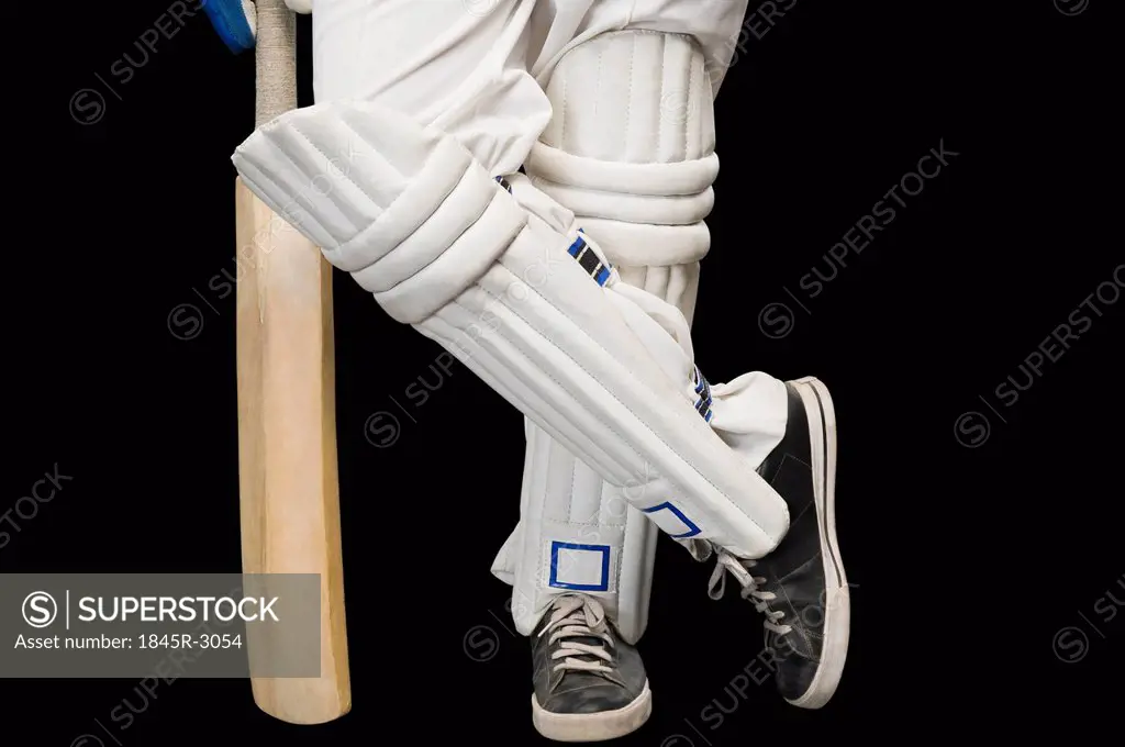 Low section view of a cricket batsman standing at a non-striker end
