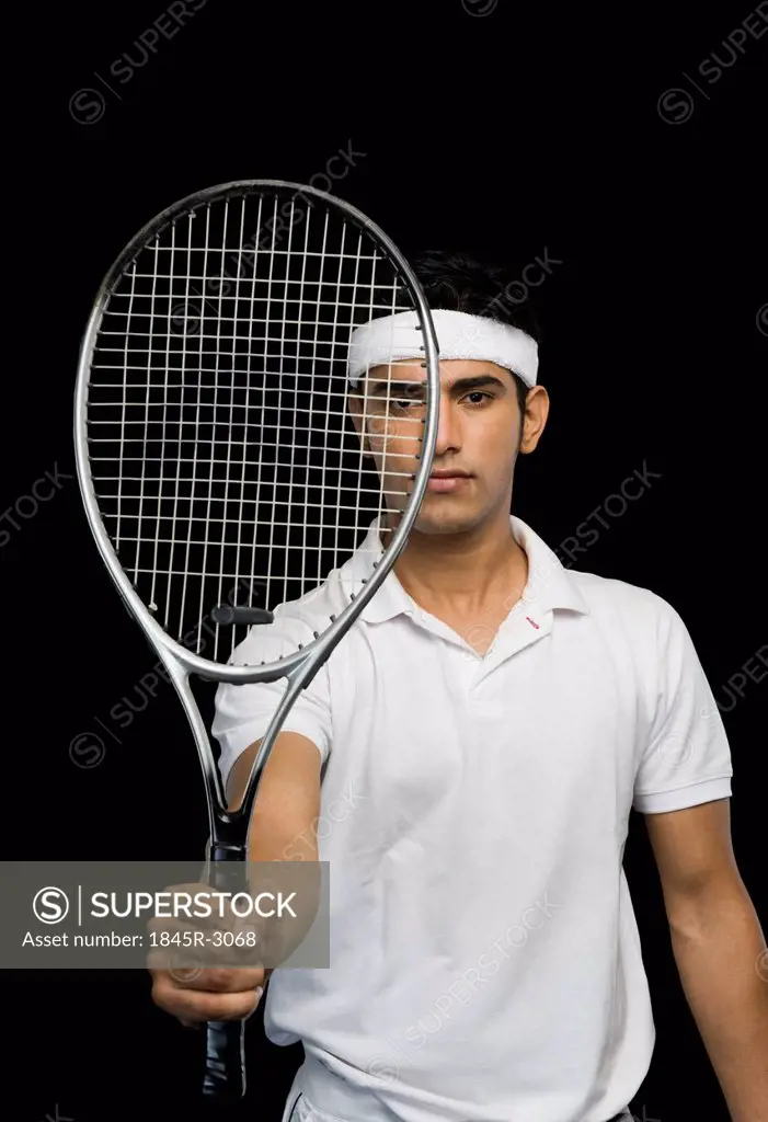 Tennis player showing a tennis racket