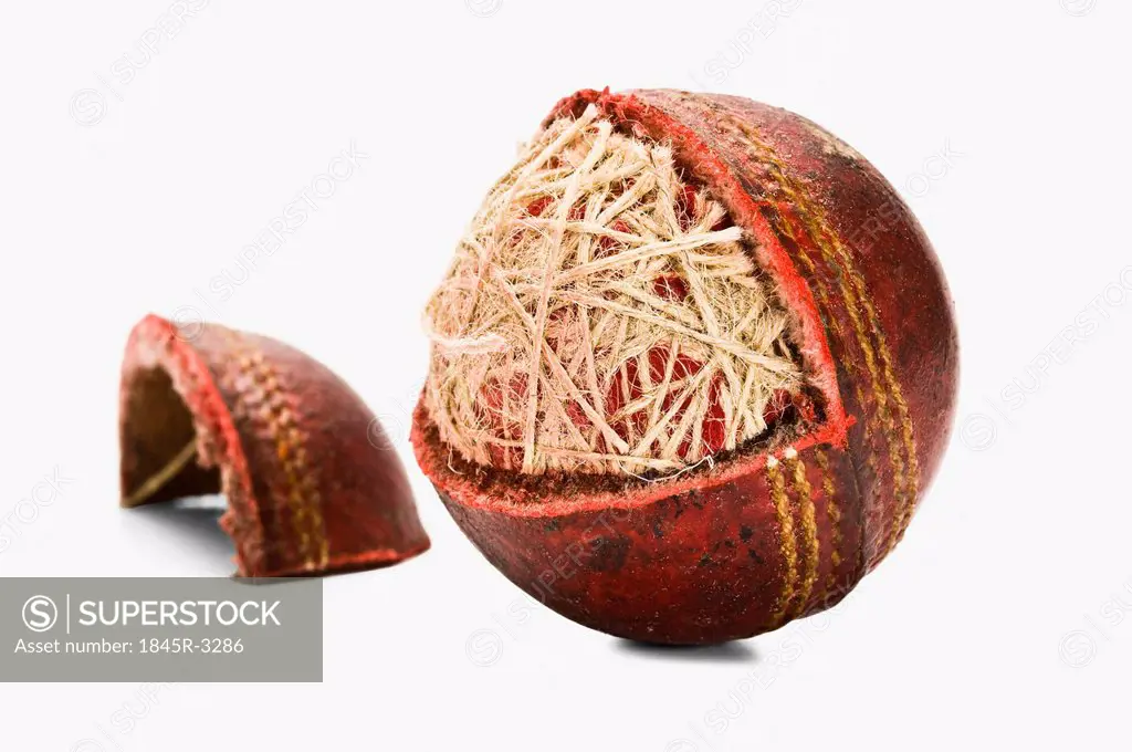 Close-up of a worn out cricket ball