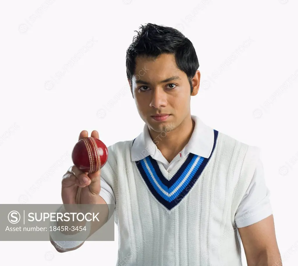 Portrait of a cricket bowler holding a ball