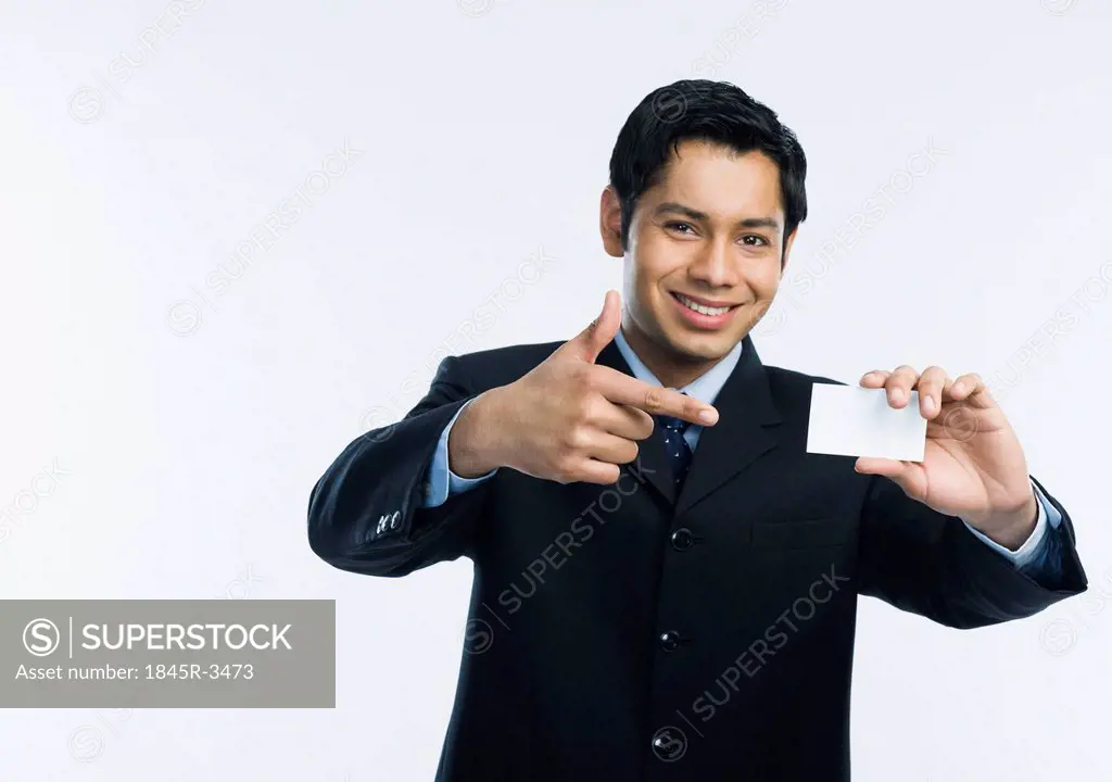 Businessman showing a blank business card
