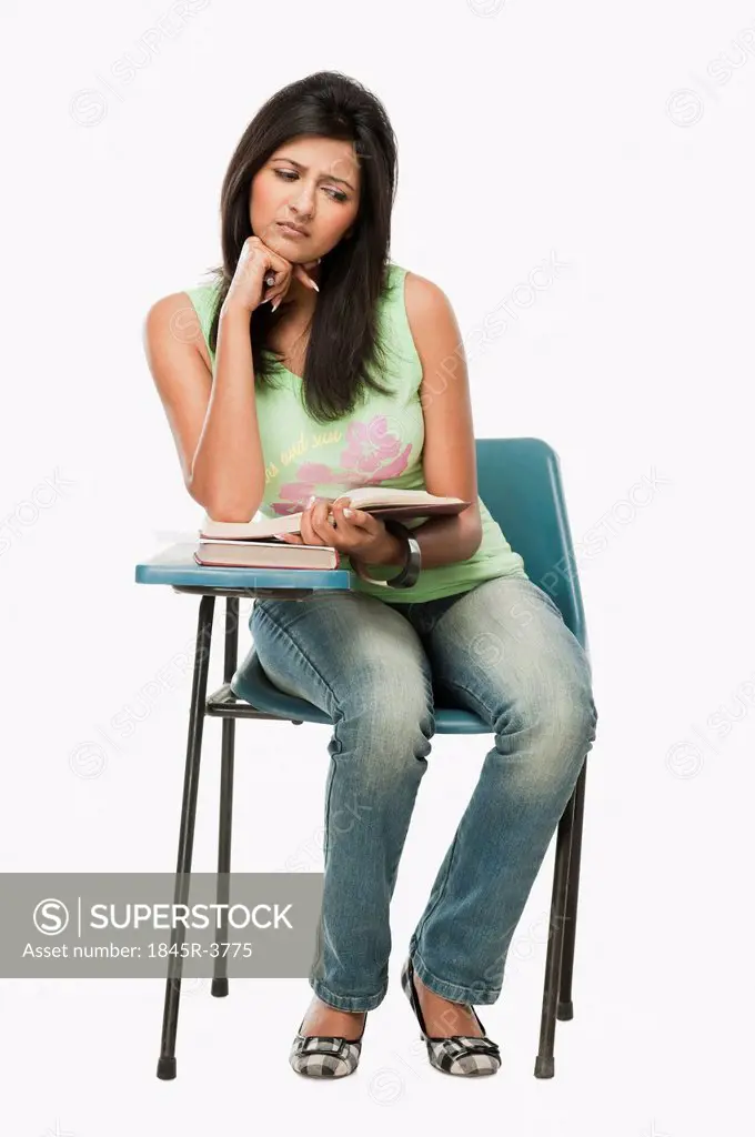 University student thinking in a classroom