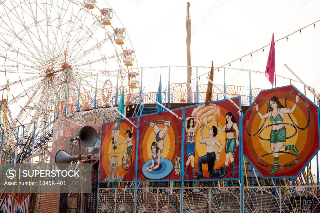 Sign boards of a circus and ferris wheel in Pushkar Camel Fair, Pushkar, Ajmer, Rajasthan, India