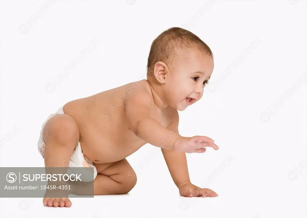 Baby boy crawling and smiling