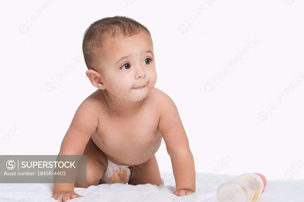 Baby boy crawling and thinking