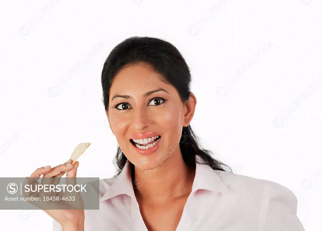 Woman eating a potato chip