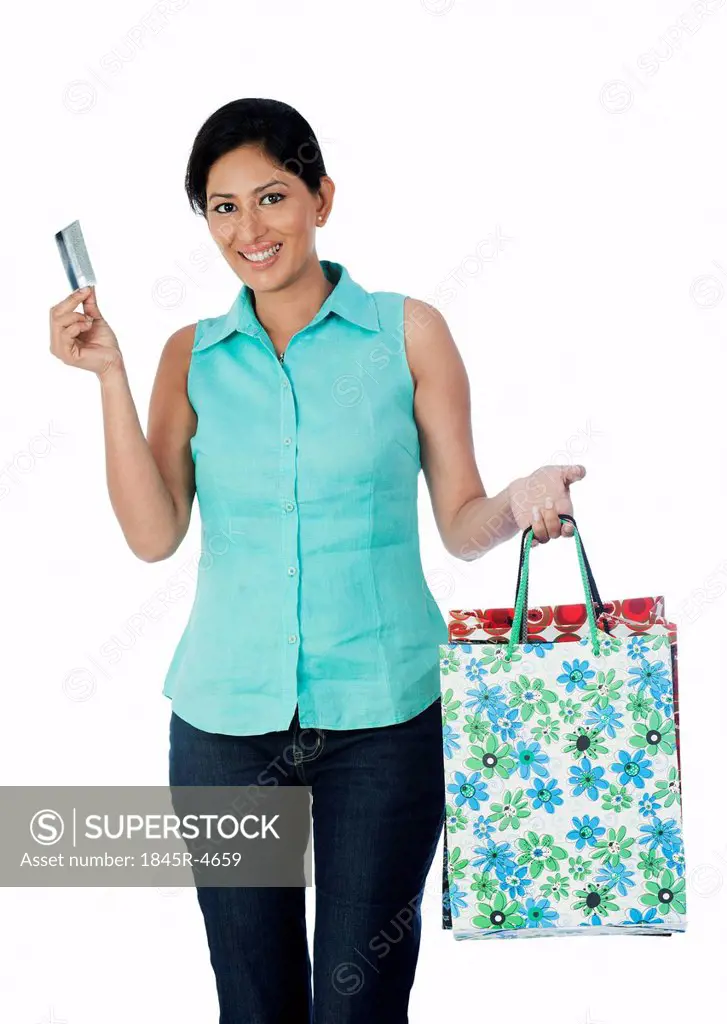Woman carrying shopping bags and a credit card