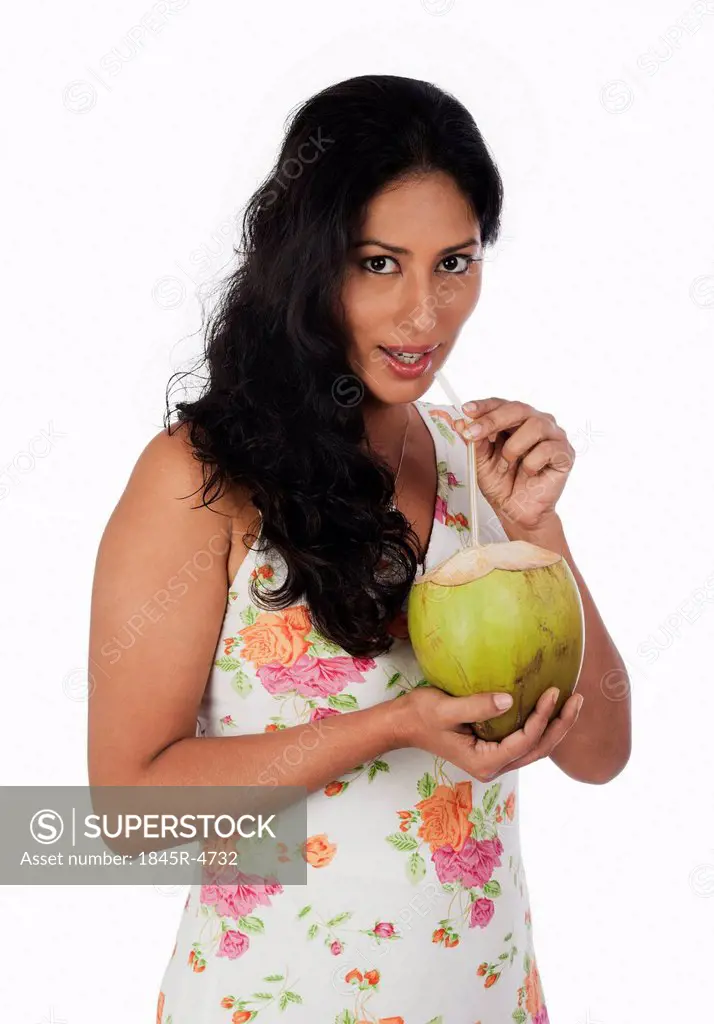 Woman drinking coconut milk