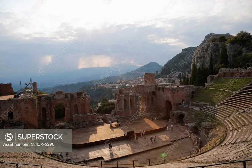 Tourists at ancient Greek theatre, Taormina, Province of Messina, Sicily, Italy