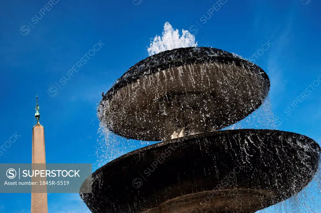 Fountain with an obelisk in the background, St. Peters Square, Vatican City