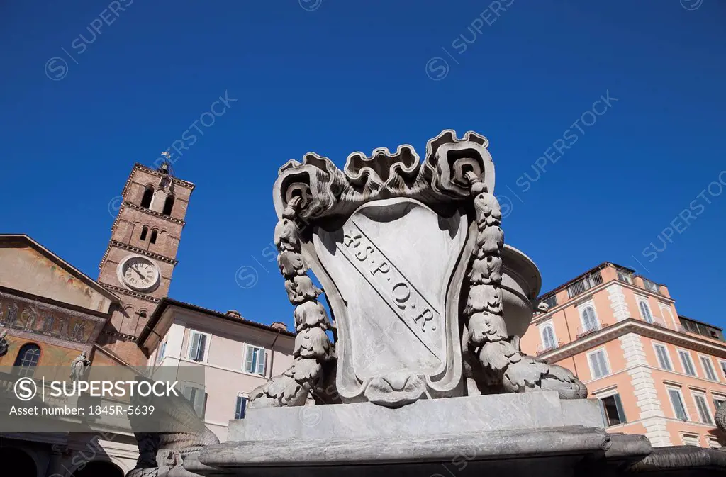 Fountain with Basilica di Santa Maria in the background, Piazza di Santa Maria in Trastevere, Rome, Lazio, Italy